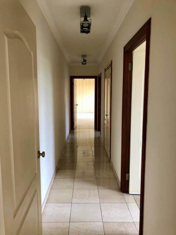 Spacious living room with sliding glass doors to terrace, tile floors in PH Vistanova Panama City