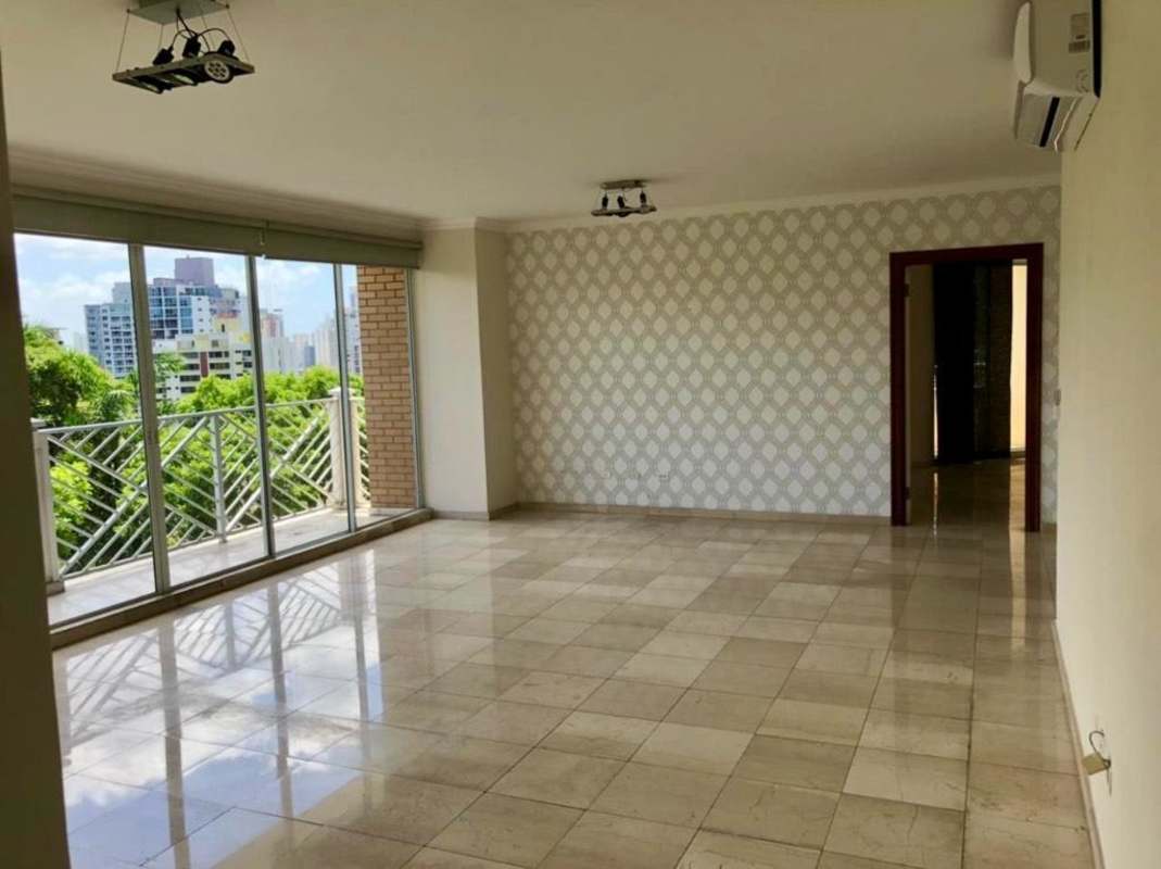 Bright living area with large sliding doors overlooking city in PH Vistanova El Cangrejo