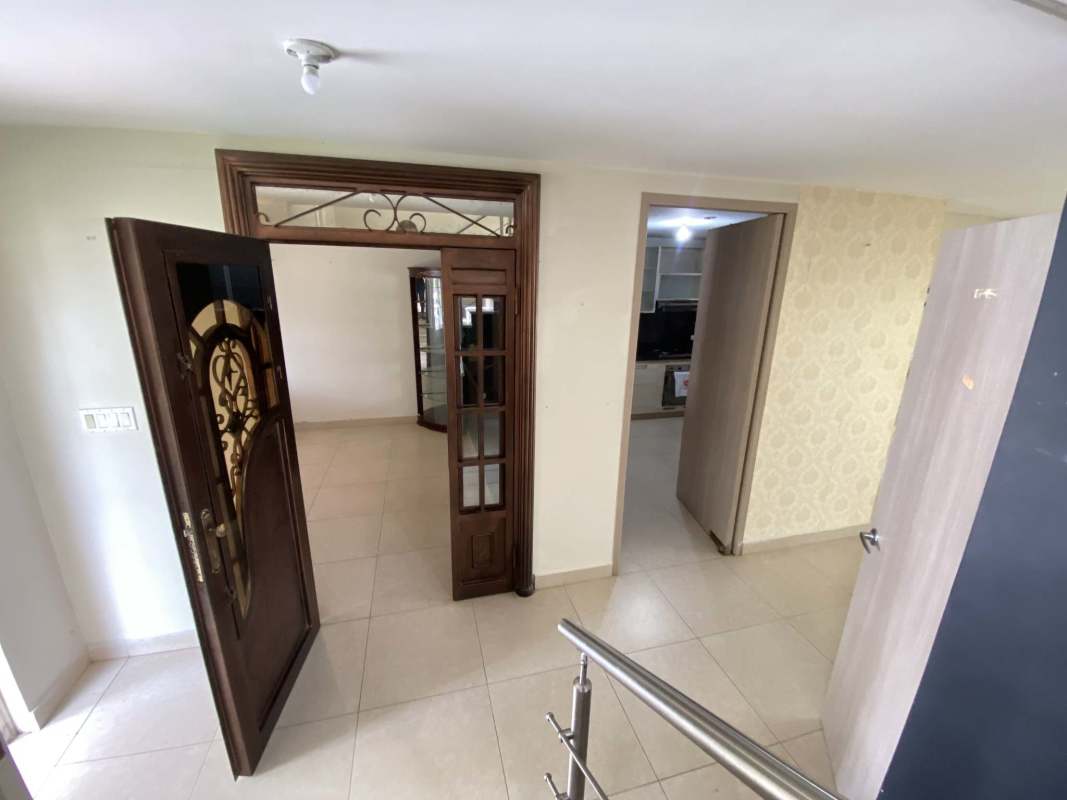 Bright double-height living dining area with ceramic tiles in PH Reserva de Versalles Costa Sur Panama