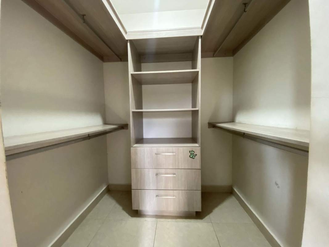 Large walk-in closet with built-in organizers PH Reserva de Versalles Costa Sur Panama
