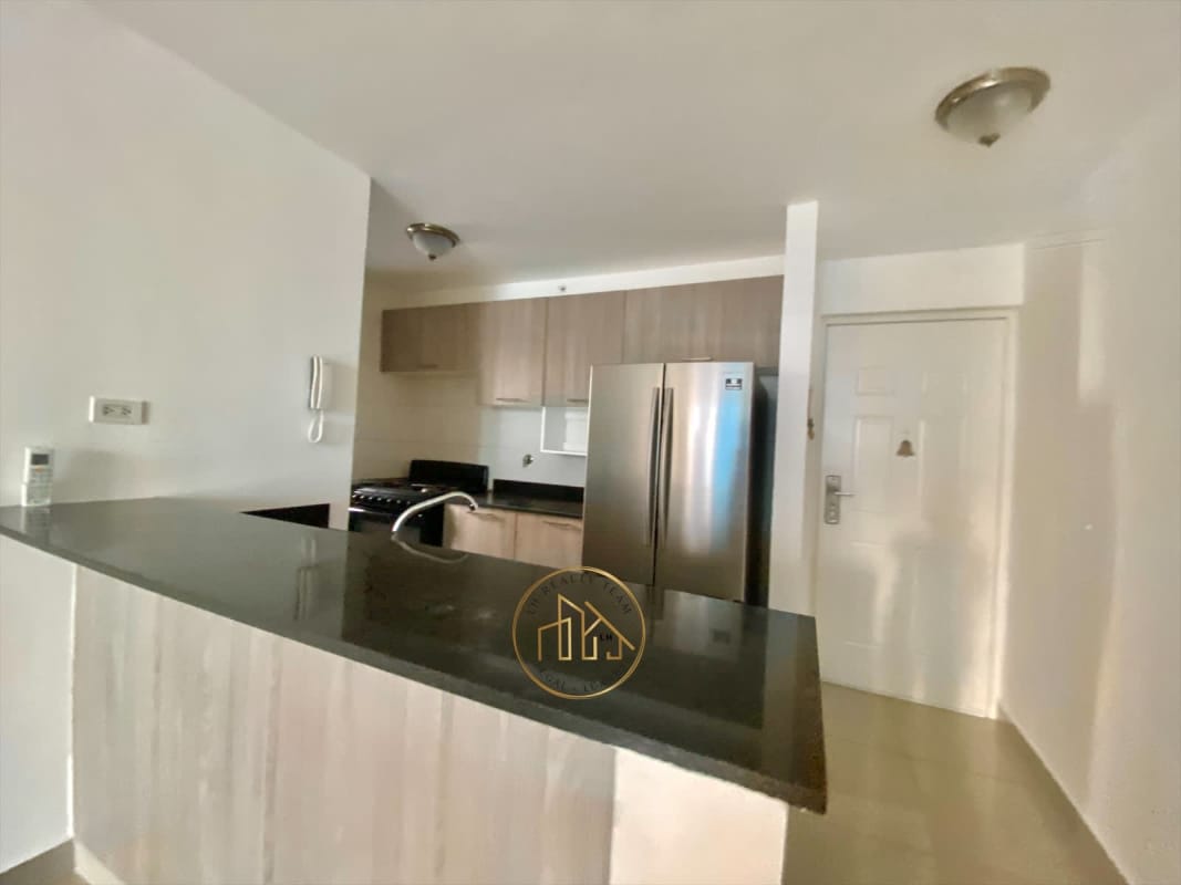 Modern lobby reception area with sofas and mirrored wall at PH Coral Towers Carrasquilla Panama