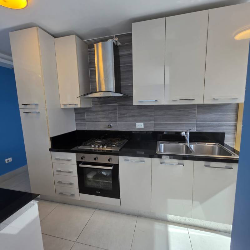 Bedroom with floor-to-ceiling window and city skyline view PH Park City Panama City