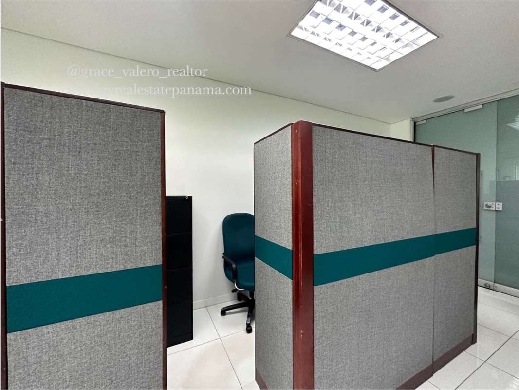 Interior workspace with glass-walled office partitions in Global Bank Tower Panama City