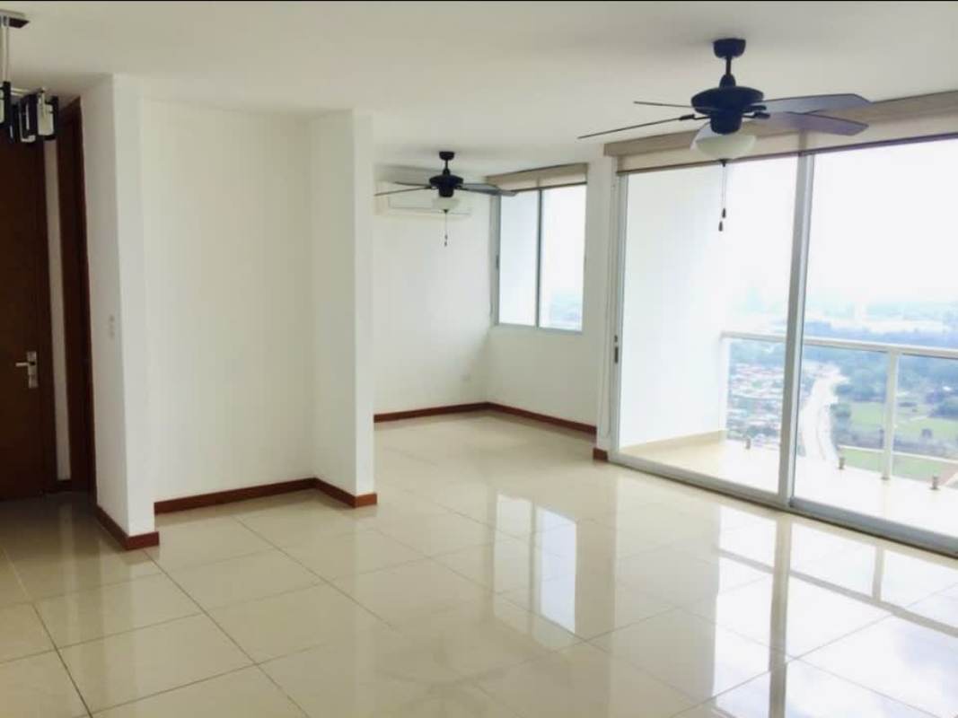 Spacious living dining area with large windows, balcony access and sea view in Coco del Mar