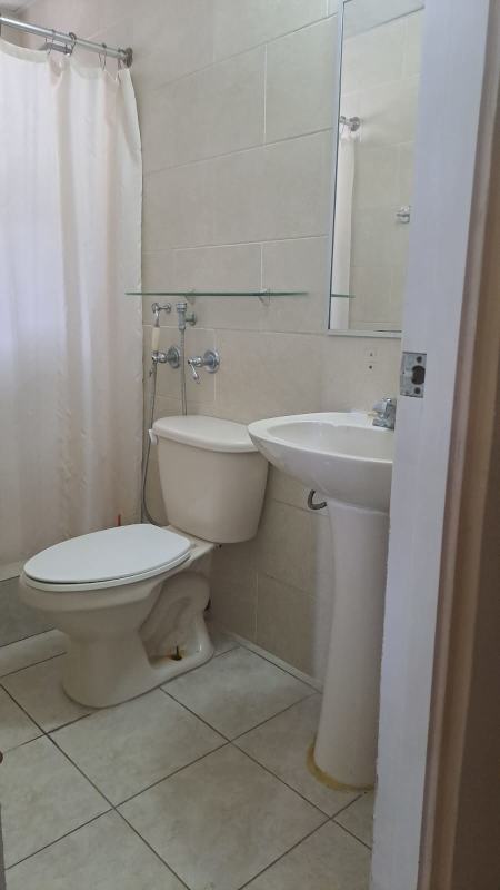 Contemporary bathroom with tiled walls, pedestal sink, glass shelf, and shower PH Mallorca Park Garden