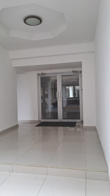 Compact kitchen and in-unit laundry area with appliances PH Mallorca Park Garden Los Andes Panama