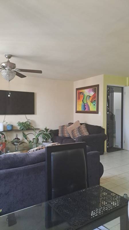 Living and dining room with tile flooring, modern furniture PH Mallorca Park Garden apartment Panama