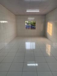 Wide interior space with tiled floors and large window grid in commercial location La Arena Chitré Panama