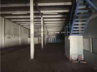 Blue metal staircase and mezzanine interior warehouse Zona Libre Colon Panama