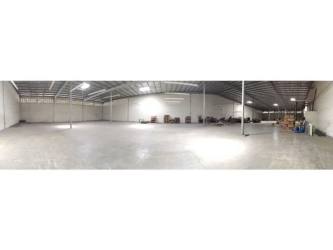 Spacious empty warehouse floor with tall industrial ceiling Colón Free Zone Panama