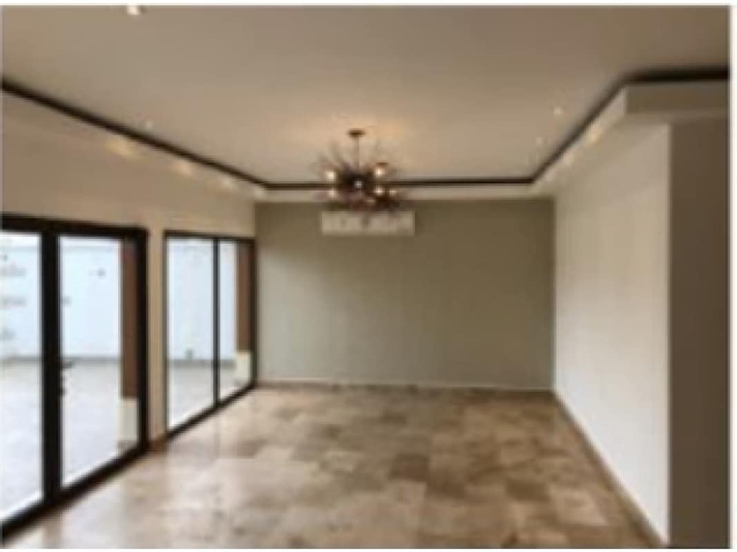 Luxury kitchen with island, granite countertops, pendant lights at Sunset Coast Costa Sur Panama City