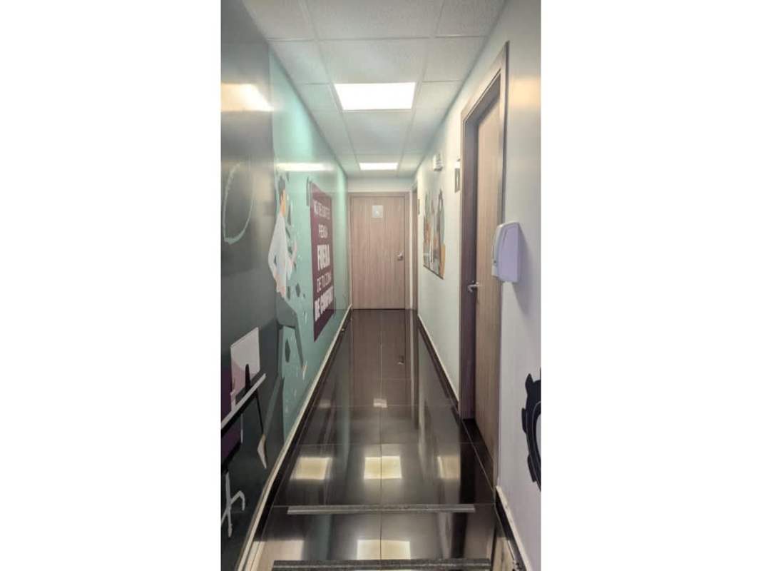 Commercial bathrooms with dual sinks tile finishes in Plaza Via España Bella Vista