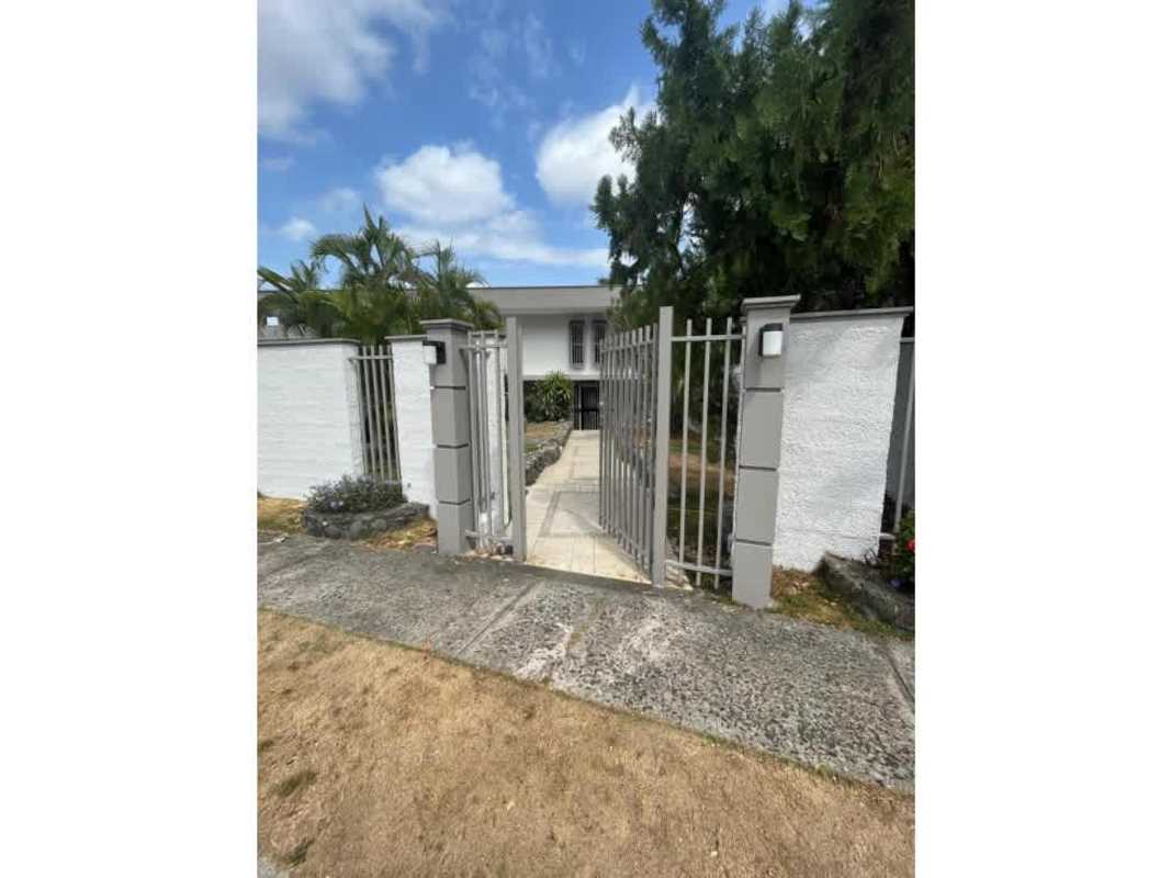 Outdoor covered gazebo ideal for barbecues and entertaining next to private garden and pool