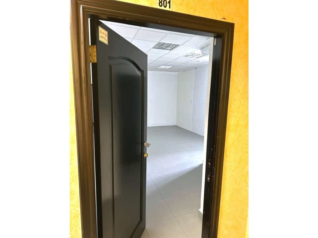 Modern empty office with gray tiled floors and large windows Plaza Morica Panama