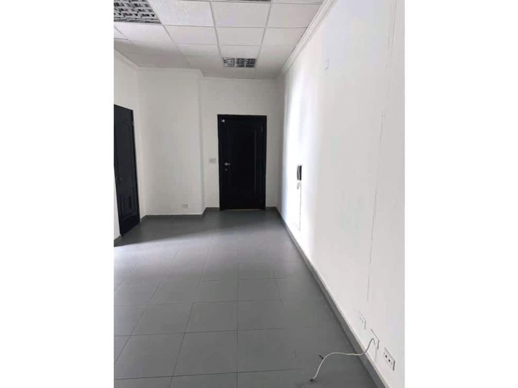 Bright hallway with glass double doors and tiled floor Plaza Morica