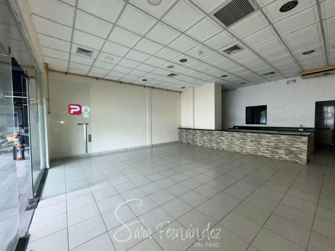 Empty retail space with large glass doors, tiled floor and recessed lights Costa del Este Panama