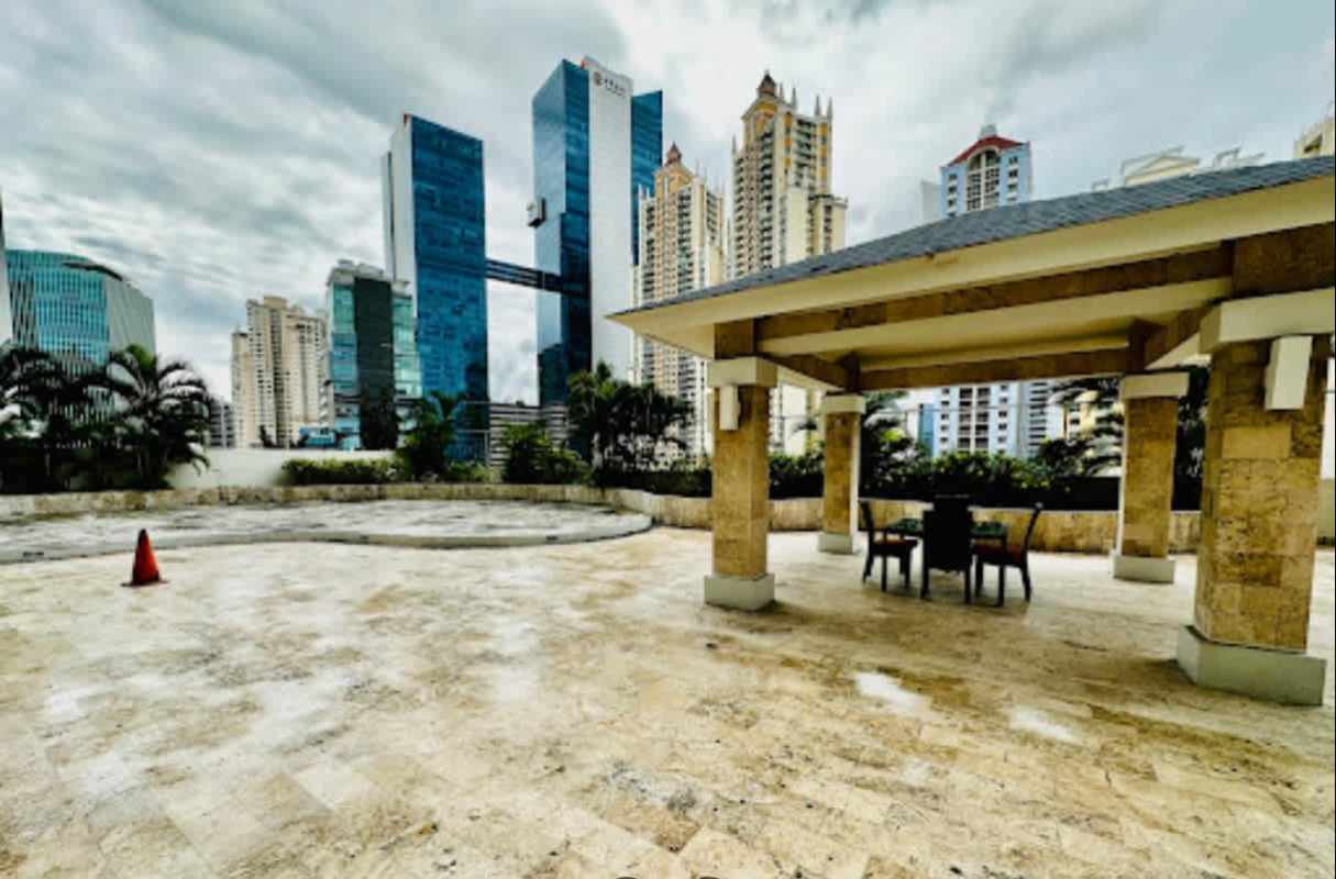 Furnished master bedroom with ocean view window, bed, and modern decor in PH Dupont Tower Panama