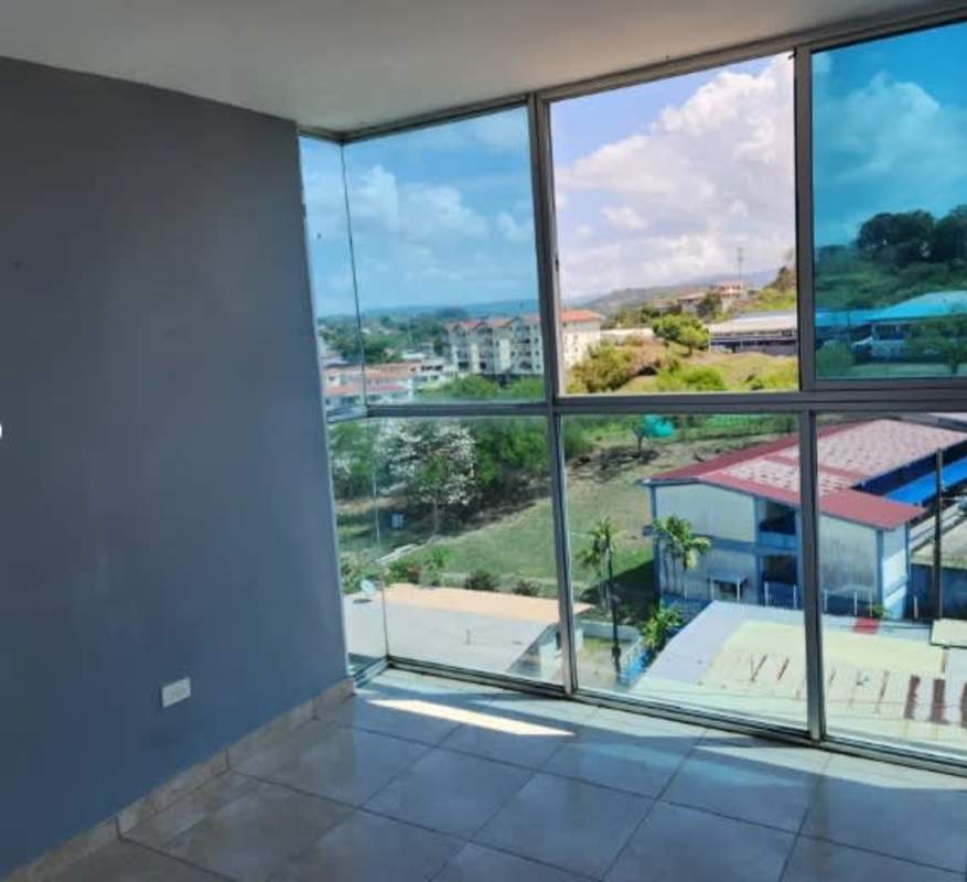 Corner bedroom or living area with panoramic windows hill and city views PH Torres del Crisol Panama