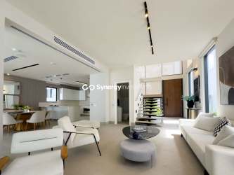 Modern dining area with pool view through sliding doors in Panama Pacifico