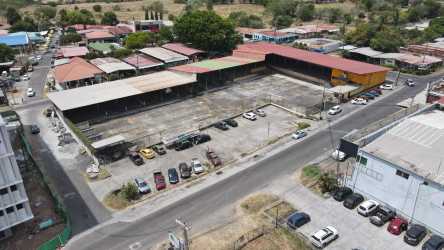 Aerial view of the large parking lot, covered warehouses and road access at Casa Goly commercial complex Chitré Panama