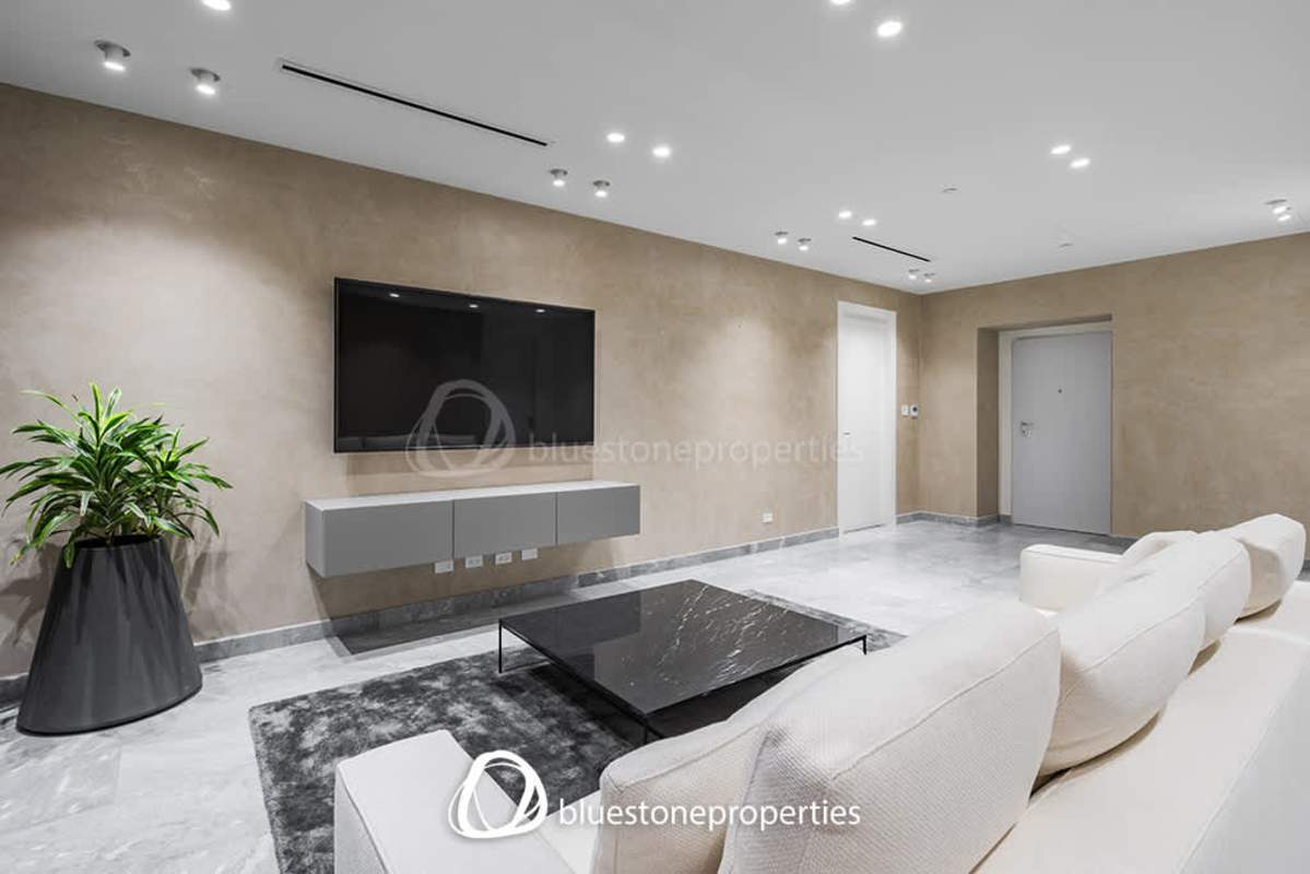 Spacious living room with marble floors and panoramic ocean view in Costa del Este apartment PH Marea