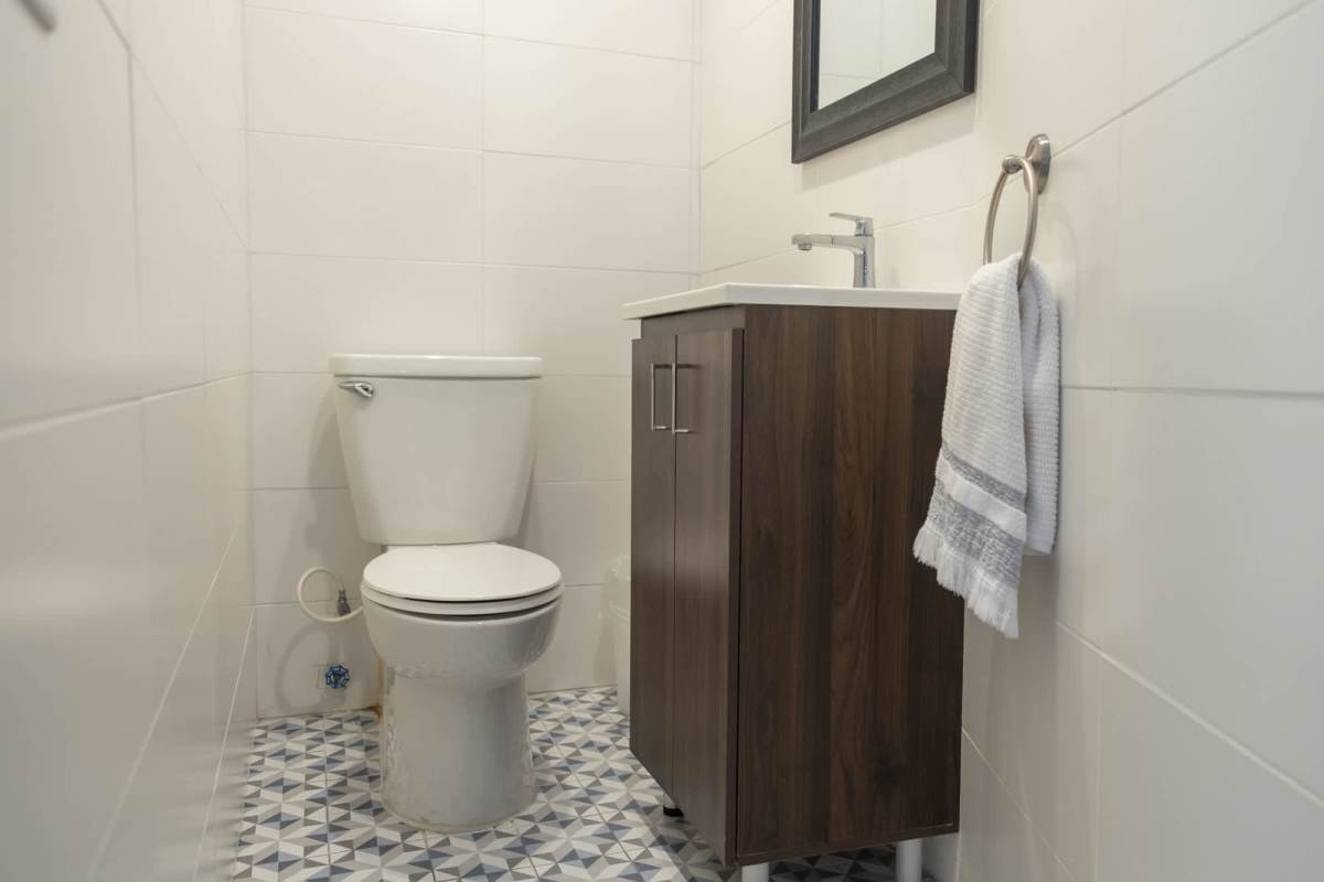 Master bedroom with floor-to-ceiling windows walk-in closet in Loft El Cangrejo Panama