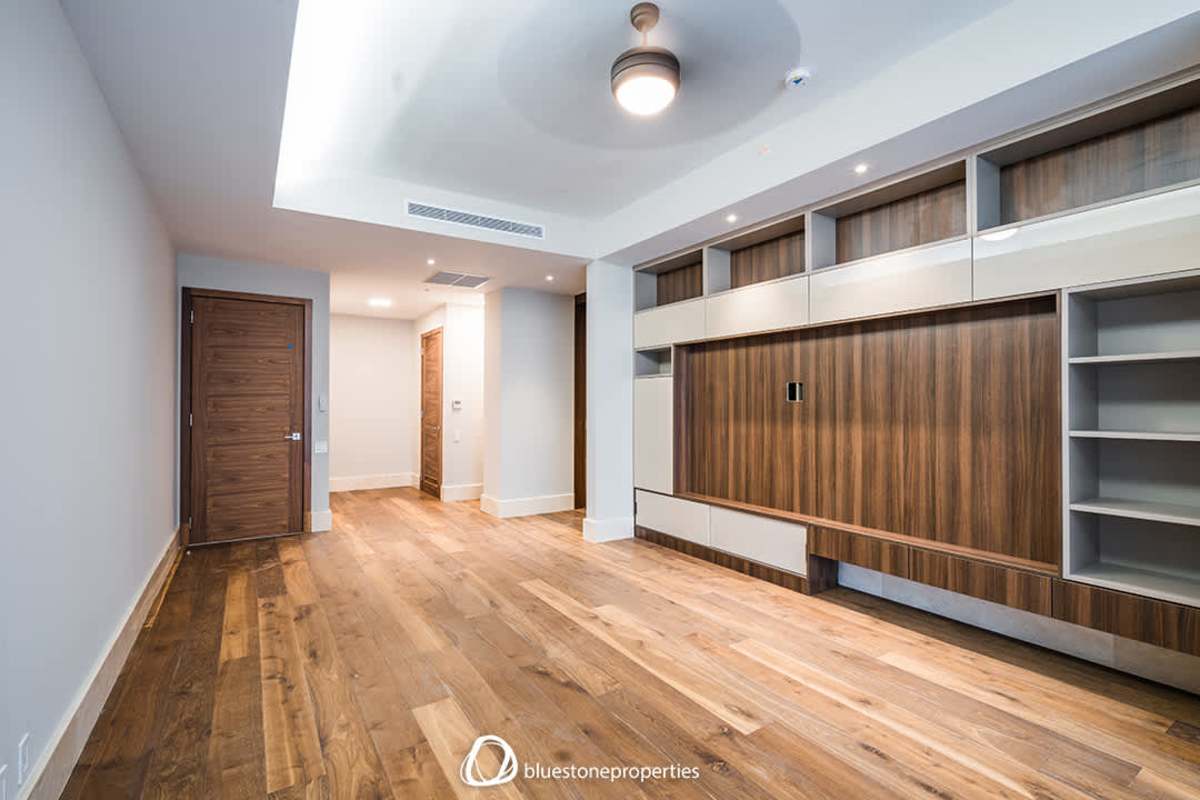 Bathroom with double vanities, glass walk-in shower, marble accents inside luxury Santa Maria Golf residence