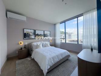 Spacious terrace ideal for outdoor dining, covered for shade, overlooking greenery in Panama Pacifico