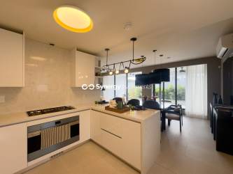 Contemporary bathroom with glass-enclosed shower and designer fixtures in Panama Pacifico duplex home