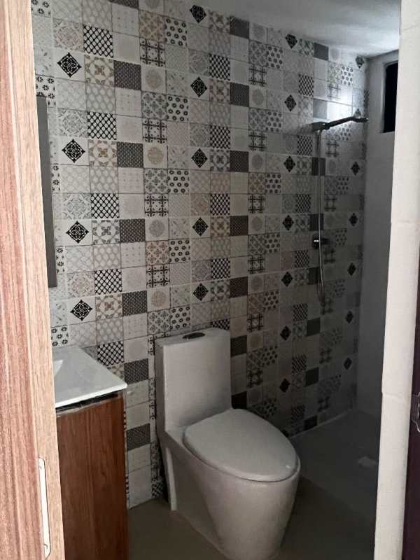 Swimming pool area with lounge chairs at Worldwide Plaza Panama apartment complex