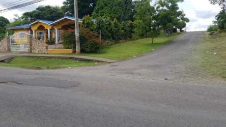 Yellow house fenced yard corner lot commercial land for sale in La Chorrera Panama Oeste