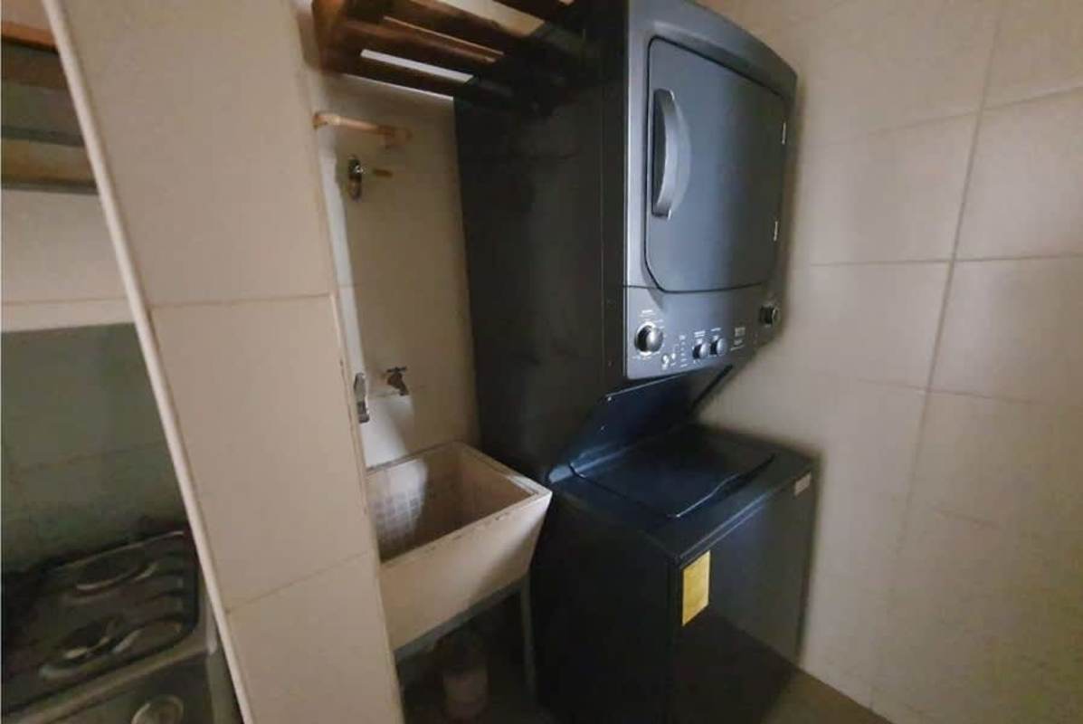 Bright living and dining space with ceramic flooring and balcony in PH 4 Islas Panama City