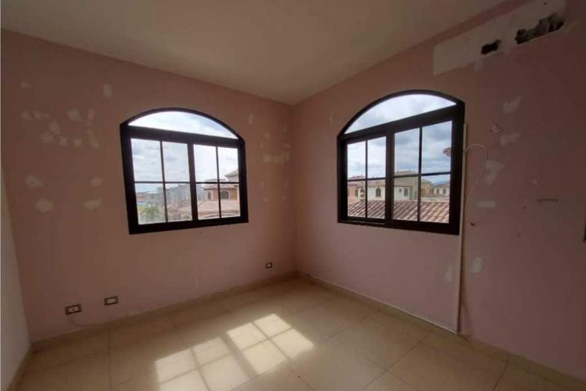 Bright large living room with tiled floors and arched windows PH El Doral house Panama City