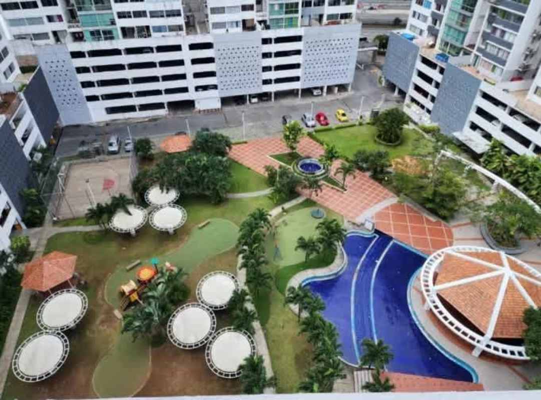 Aerial photo of swimming pool, playground, gazebos in PH Central Park residential complex Panama City