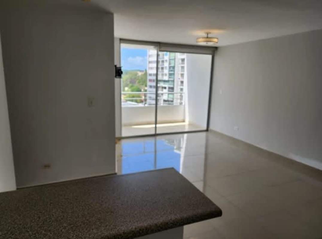 Open plan living dining room with balcony view PH Central Park 12 de Octubre Panama City