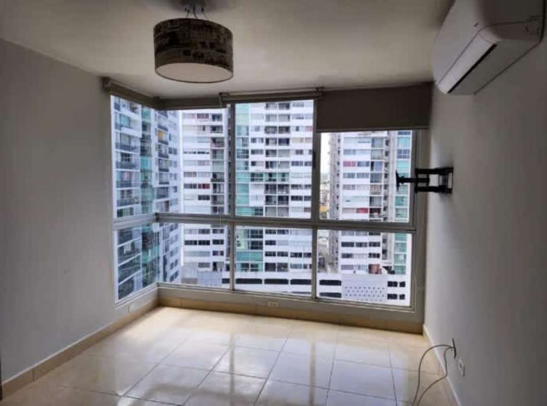 Modern living room with large corner windows city view tile floor PH Central Park 12 de Octubre Panama