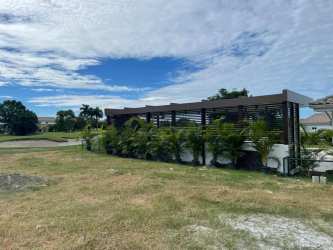 Pergola feature lush landscaping near golf course Bijao Panama