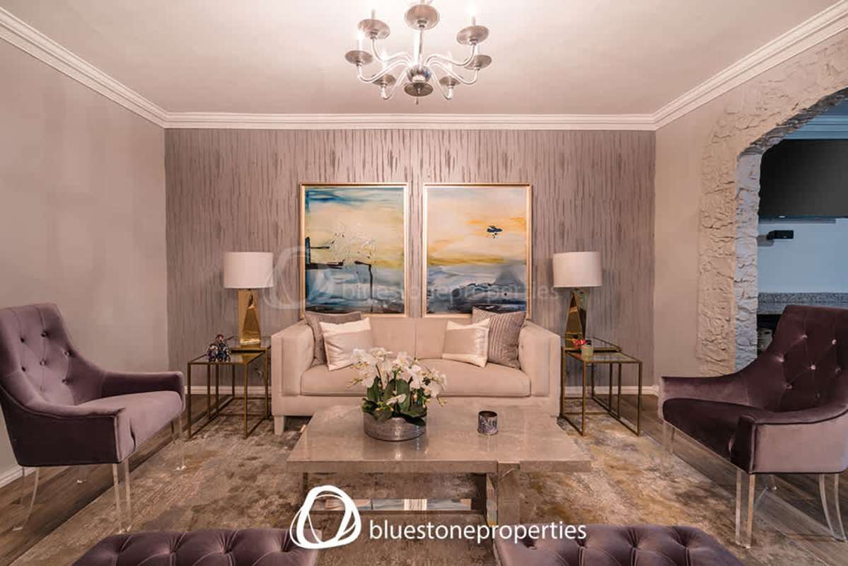 Spacious kitchen with granite countertops wood cabinetry and large windows at PH Bahia Marbella