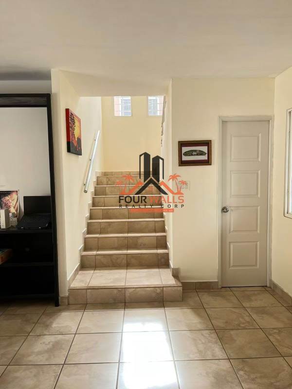 Open plan living room and dining area with glass sliding doors to patio in PH Everest Brisas del Golf Panama