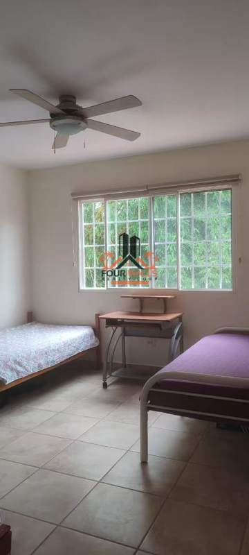 Dining area featuring glass table, large sliding doors, built-in shelving PH Everest Brisas del Golf Panama