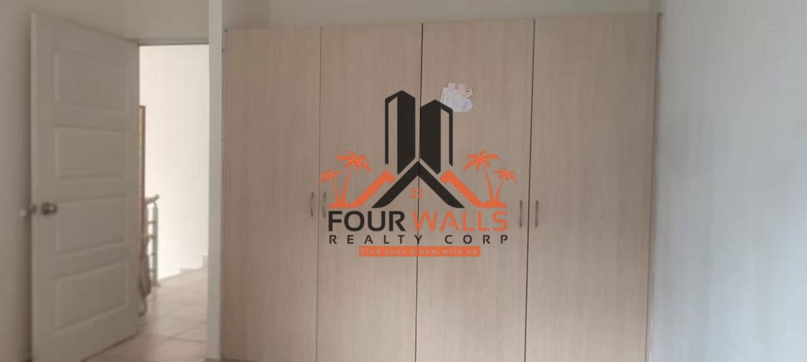 Home office or dining space with sliding doors, laptop and outside garden PH Everest Brisas del Golf Panama