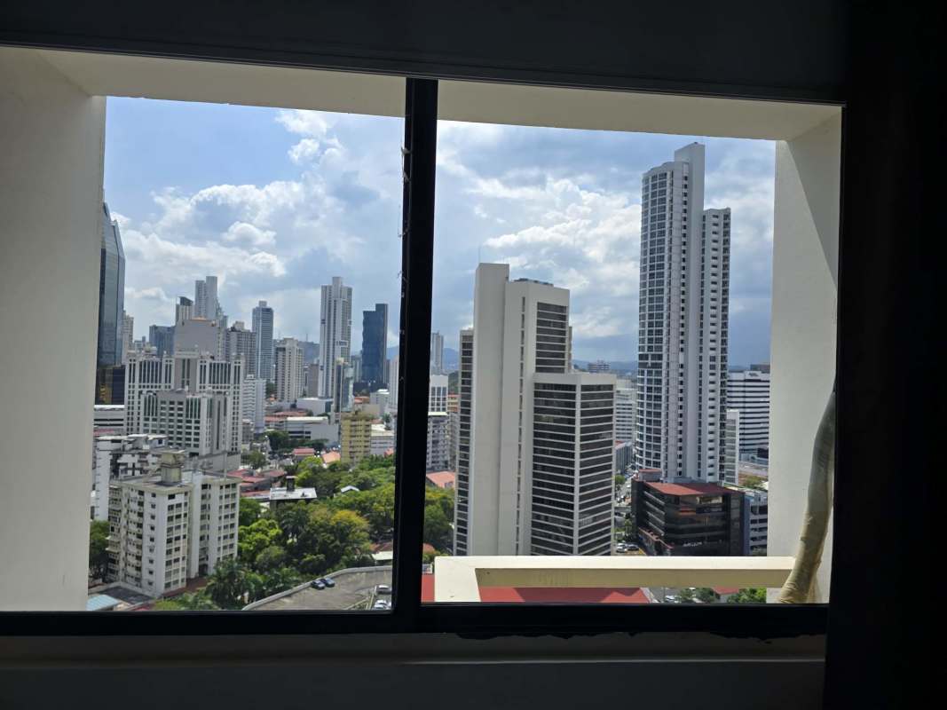 Modern city skyline from Obarrio Suites high-rise window Panama City Panama