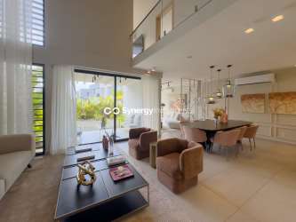 Spacious living and dining room with high ceiling and modern finishes