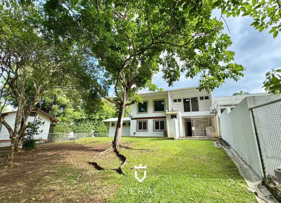 Two-story house with driveway and gated yard in Cardenas Village Ancón Panama