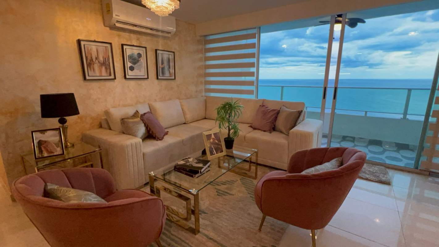Contemporary living area with ocean view, large windows and modern decor in Panama City