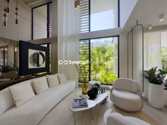 Open living and dining area with floor-to-ceiling glass, contemporary furnishings