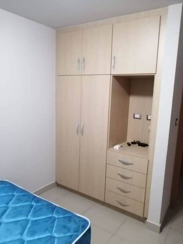 Bathroom with walk-in glass shower and granite sink countertop PH Rokas Ancon Panama