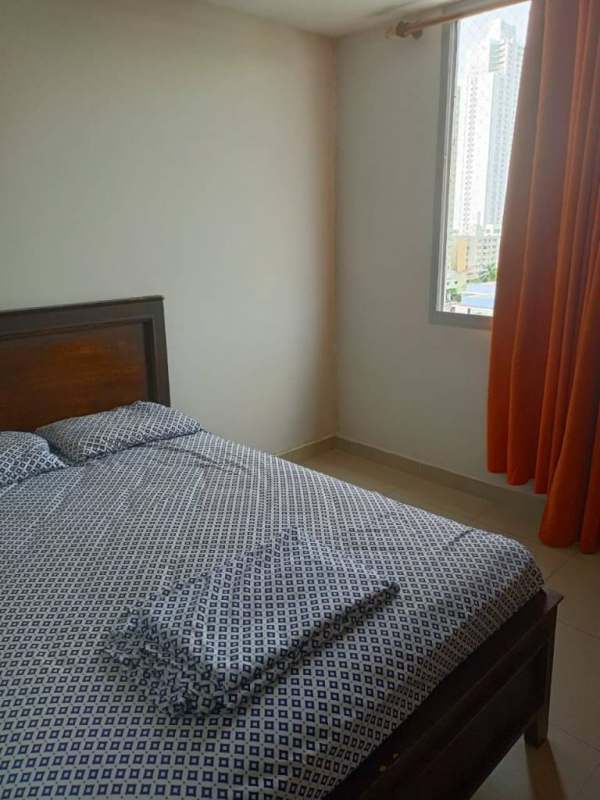 Bedroom with built-in wardrobe, large window, tiled floor in PH Rokas Tower 8 Ancon Panama