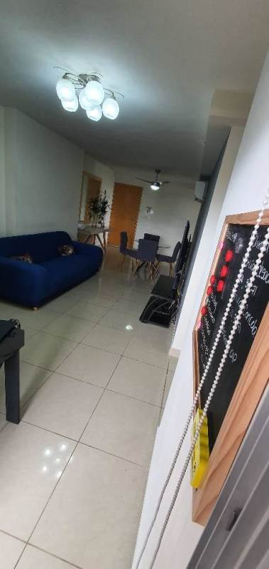 Galley kitchen with modern cabinetry, large window, refrigerator and stove PH Rokas Ancon Panama