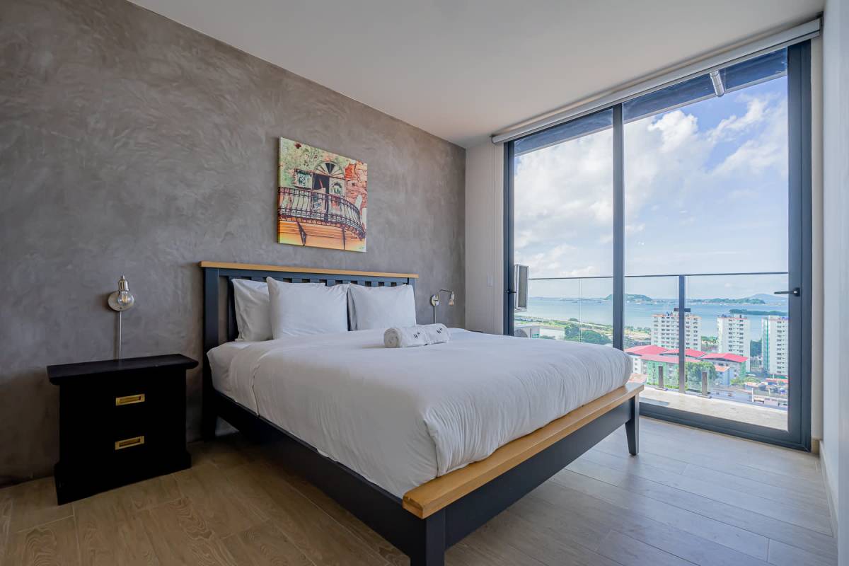 Master bedroom with ocean view balcony floor to ceiling windows PH Casco View Casco Viejo Panama City